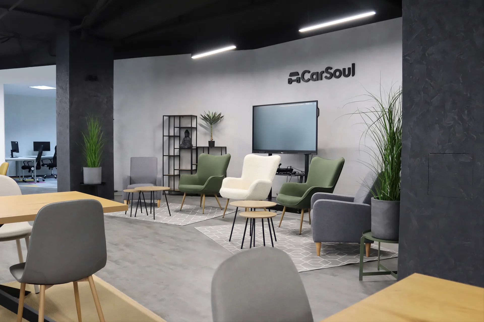 Modern coworking space with plants and communal workspace